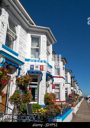 Street of colourful floral decked Guest Houses near the seafront, in Great Yarmouth, Norfolk, England, UK Stock Photo