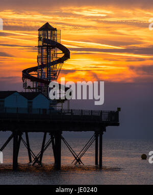Kent, UK. 21st Jun, 2017. UK Weather. The longest day of the year ends with a beautiful sunset at Herne Bay, Kent. The shot shows the helter skelter located on the end of the pier. Credit: Paul Martin/Alamy Live News Stock Photo