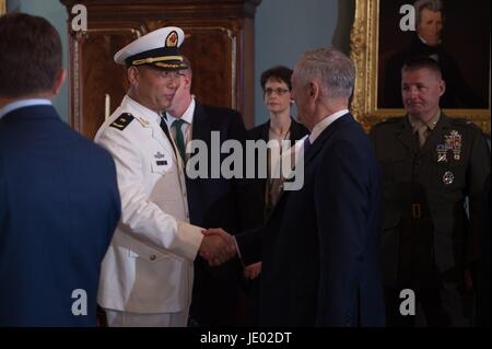 Washington, United States Of America. 21st June, 2017. U.S. Defense Secretary Jim Mattis, right, greets Chinese Rear Admiral Wei Gang, Navy Commander of East Sea Fleet before the inaugural U.S.-China Diplomatic and Security Dialogue at the State Department June 21, 2017 in Washington, DC. Credit: Planetpix/Alamy Live News Stock Photo