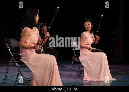 Shenyan, Shenyan, China. 22nd June, 2017. Shenyang, CHINA-June 22 2017: (EDITORIAL USE ONLY. CHINA OUT) .The 18-year-old orphan twins Zhao Chunqing and Zhao Chunmeng hold a concert of traditional Chinese musical instrument erhu in Shenyang, northeast China's Liaoning Province, June 22nd, 2017. They expressed thankness to their teacher at the end of the concert. Credit: SIPA Asia/ZUMA Wire/Alamy Live News Stock Photo