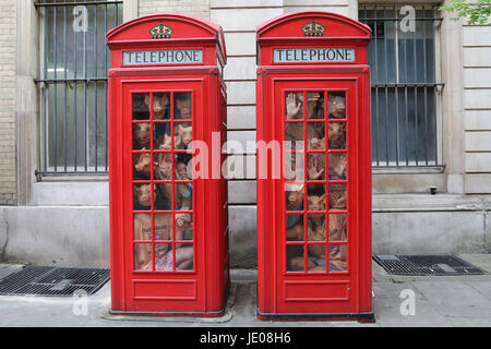 London, UK. 22nd June, 2017. Marchioness Tracy Worcester with campaigners squeezing into telephone boxes in a new stunt designed to replicate the conditions factory farm pigs are kept in. The campaign aims to strengthen the consumer revolt against the horrific environments where overcrowding and stress suffered by pigs mean they have to routinely given ever stronger antibiotics to stave off disease. The stunt coincides with the release of a new series of video called Rooting for Real Farms. Credit: Dinendra Haria/Alamy Live News Stock Photo