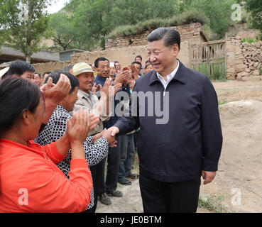 Taiyuan, China's Shanxi Province. 21st June, 2017. Chinese President Xi Jinping (R) talks with local villagers in Zhaojiawa Village of Kelan County in Xinzhou City, north China's Shanxi Province, June 21, 2017. Xi had an inspection tour in Shanxi Wednesday. Credit: Pang Xinglei/Xinhua/Alamy Live News Stock Photo
