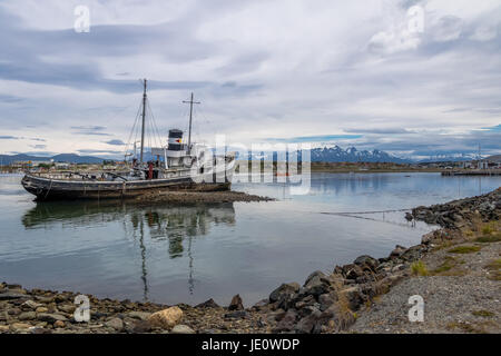 Abandoned HMS Justice tug boat grounded in Patagonia - Ushuaia, Tierra del Fuego, Argentina Stock Photo