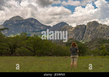A tourist seen looking at the Chimanimani mountains in Zimbabwe. Stock Photo