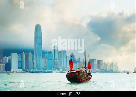 Traditional chinese-style sailboat sailing in Hong Kong harbor Stock Photo