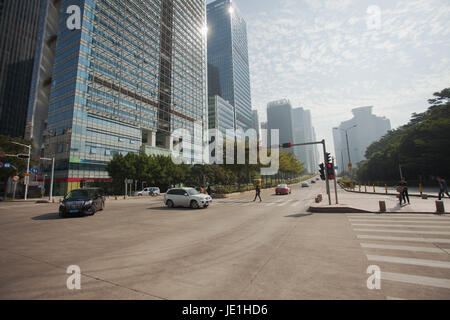 City scene from streets of Shenzhen; Guangdong province, People's republic of China; People and vehicles at street Stock Photo