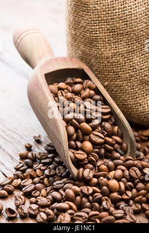 roasted coffee beans in wooden scoop Stock Photo