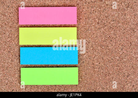 Empty colorful notes on cork background Stock Photo