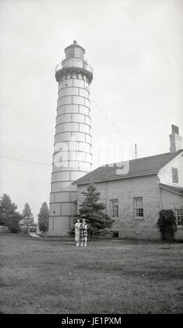 Antique c1930 photograph, Cana Island lighthouse in Wisconsin. The Cana Island lighthouse is a lighthouse located just north of Baileys Harbor in Door County, Wisconsin, United States. SOURCE: ORIGINAL PHOTOGRAPH. Stock Photo