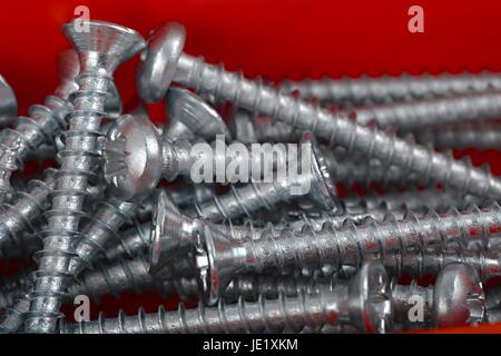 A pile of screws in a box Stock Photo