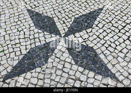 Portuguese traditional patterned cobblestones in Lagos Portugal Stock Photo