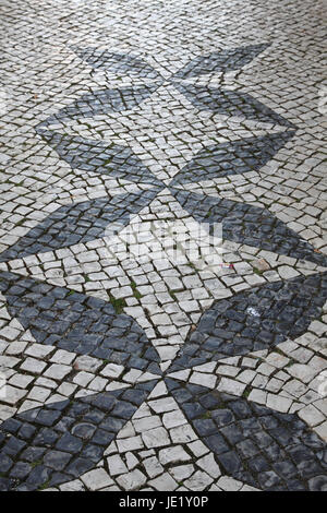 Portuguese traditional patterned cobblestones in Lagos Portugal Stock Photo