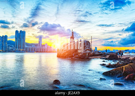 Hong Kong Sunset, Yau Tong Lei Yue Mun water bay and lighthouse Stock Photo