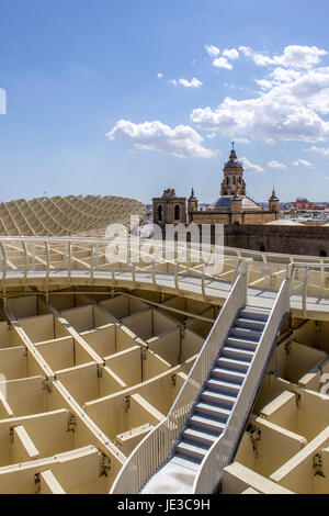 SEVILLE, SPAIN - MAY 2014: Panoramic view in the top of Metropol Parasol in Plaza de la Encarnacion on 31 of May 2014 in Sevilla,Spain. the extraordinary new Seville Market Hall an attractive destination for tourists and locals alike. Projected by J. Mayer H. architects, it is made from bonded timber with a polyurethane coating. Stock Photo