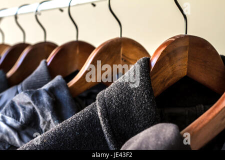 Winter clothes hanged on a clothes rack Stock Photo
