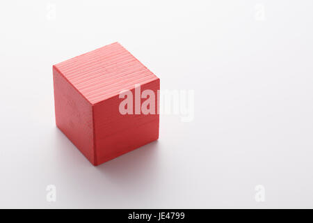 Red wooden cube isolated on white background. Stock Photo
