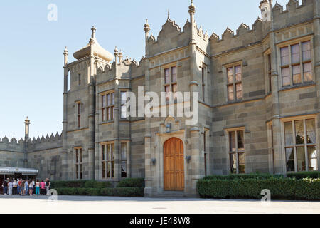 ALUPKA, RUSSIA - SEPTEMBER 28, 2014: people near northern entrance facade of Vorontsov (Alupka) Palace in Crimea. The palace was built between 1828 and 1848 for Prince Vorontsov. Stock Photo