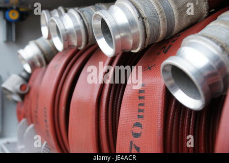70mm hose and 45mm hose, fire fighting hose in fire engine locker ready for fast deployment, fire service equipment Stock Photo