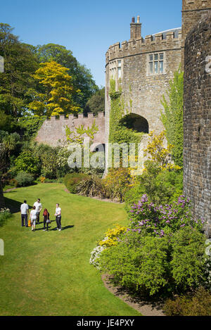 Visitors walking in the grassed moat at Walmer Castle Deal Kent UK Stock Photo
