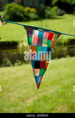 Fabric Bunting in a garden Stock Photo - Alamy