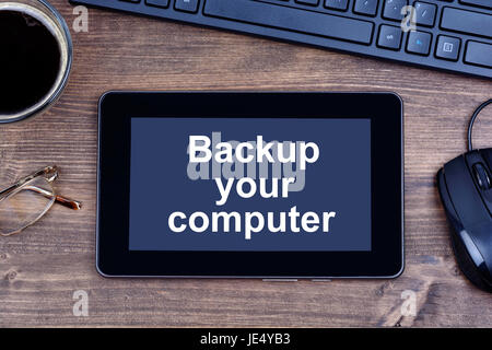 Text Backup your computer words on digital tablet pc Stock Photo