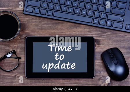 The words Time to update on digital tablet pc Stock Photo