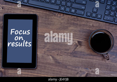 Focus on results words on digital tablet pc Stock Photo