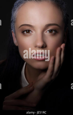 Charm. Charisma. Aristocratic Woman's Face in Shadow Stock Photo