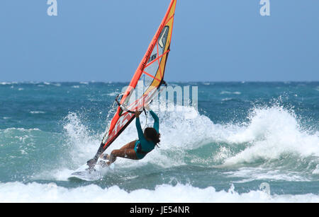 JERICOACOARA.CEARA/BRASIL - CIRCA JANUARY 2017: windsurfer sportmen Aurora is catching the wave having fun of the windsurfing Stock Photo