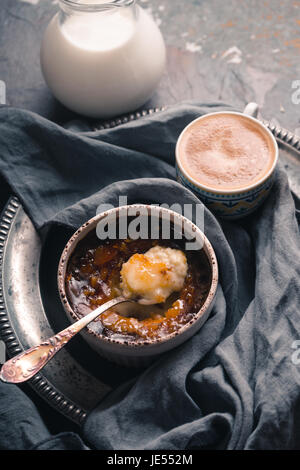 Creme brulee, jug with milk top side vertical Stock Photo