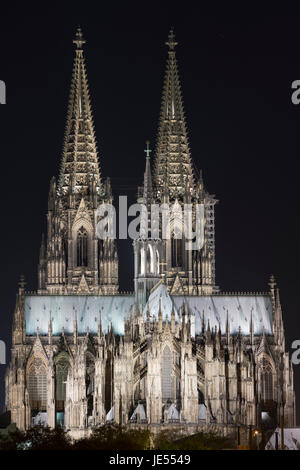 The illuminated Cathedral of Cologne is very impressive. The church was first building in the world with floodlight (October, 15th 1880). The just invented Otto-engines were producing electricity for arc lamps.  In 1996, the cathedral was added to the UNESCO World Heritage List. Stock Photo