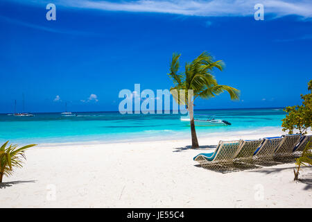 Sunbed on topical beach ,Beach chairs on sand Stock Photo