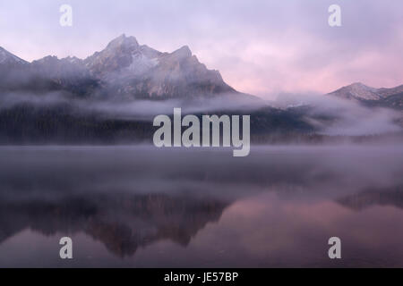 A morning mist rises over Lake Stanley and the distant McGowan Peak in fall in Idaho. USA Stock Photo