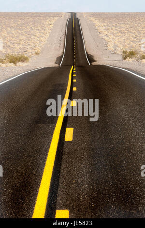 Long straight desrt road in Death Valley, California