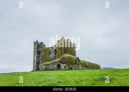 Ballycarbery Castle is a castle near  Cahersiveen, County Kerry, Ireland. The castle is situated high on a grass hill facing the sea.   The present ru Stock Photo