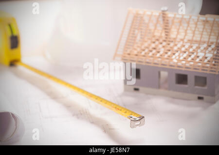 Construction plans and blueprints on wooden table Stock Photo