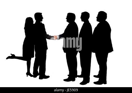 Silhouetted businessmen in a shaking hand pose. Stock Photo