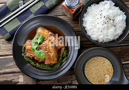 Chinese sweet steamed pork  setting on black japanese style plate in studio lighting. Stock Photo