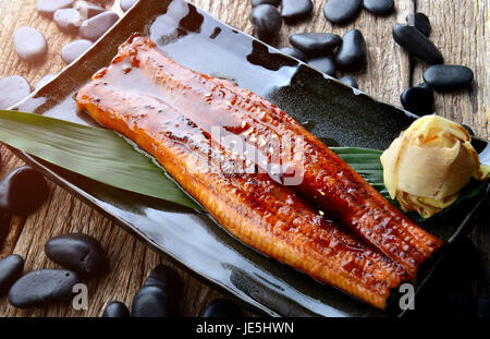 Japanese eel grilled or Unagi ibaraki set on plate in Japanese style with studio lighting. Stock Photo