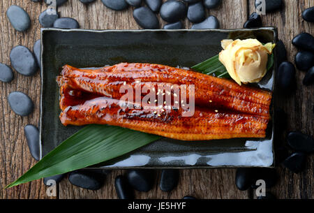 Japanese eel grilled or Unagi ibaraki set on plate in Japanese style with studio lighting. Stock Photo