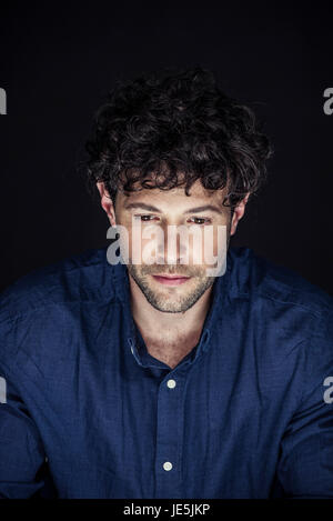 Man looking down in thought, portrait Stock Photo