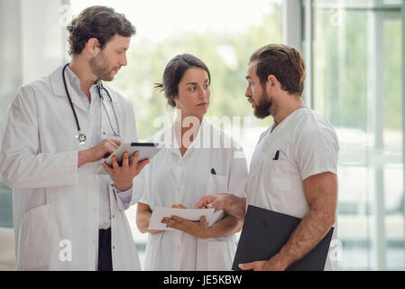 Healthcare workers conferring with each other Stock Photo