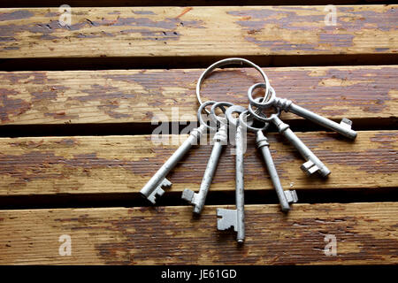 Bunch of Keys on Wooden Background Stock Photo