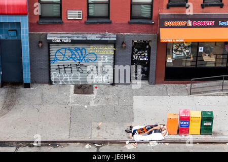 Homeless man sleeping in the East Village, Manhattan, New York City ...