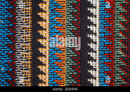 Texture of  fabric with  traditional Mexican pattern macro. A tissue sample Stock Photo