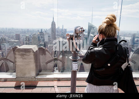 Tourist taking photos of New Yorks skyline Stock Photo