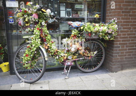 The Netherlands, Amsterdam, bicycle with flowers decorated, Stock Photo