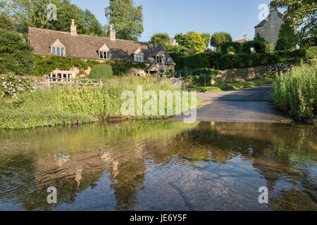 River eye ford in Upper Slaughter in the late evening june sunshine. Cotswolds, Gloucestershire, England Stock Photo