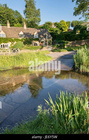 River eye ford in Upper Slaughter in the late evening june sunshine. Cotswolds, Gloucestershire, England Stock Photo