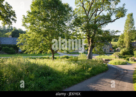 River eye ford in Upper Slaughter in the late evening june sunshine. Cotswolds, Gloucestershire, England Stock Photo